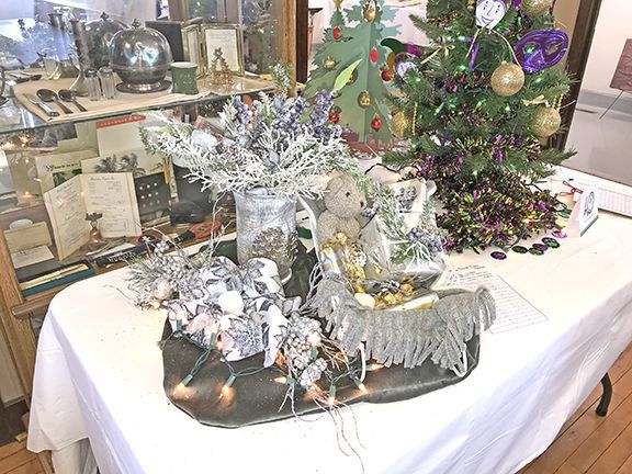 Silver sleigh with vase